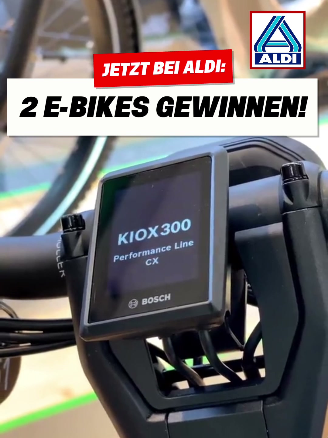 Креатив ALDI E-Bikes: крупный план дисплея KIOX 300 и красно-белая типографика